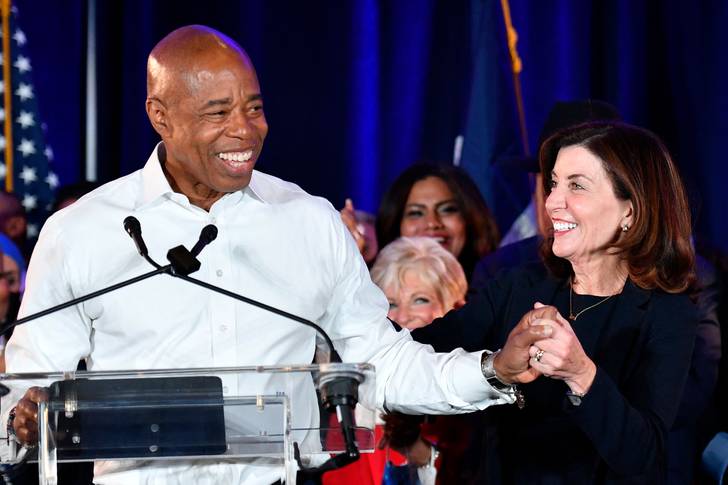 New York City Democratic Mayor-elect Eric Adams holds hands with New York Governor Kathy Hochul as he speaks to supporters during his 2021 election victory night party at the Brooklyn Marriott on November 2, 2021 in New York City